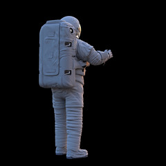 Wall Mural - standing astronaut looking into empty space, isolated on black background