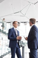 Wall Mural - Businessmen discussing plans in office