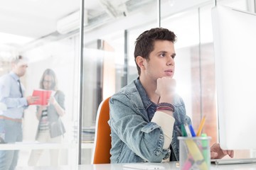 Wall Mural - Businessman busy working in his desk in office