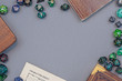 © Firn - Flat lay concept design for tabletop role playing with colorful green and blue dices, character sheet and rule books with empty copy space on gray background