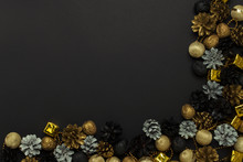 Pine Cones And Nuts Painted In Golden, Black, White Colors On A Black Background. Concept Of Happy New Year And Merry Christmas. Flat Lay, Top View