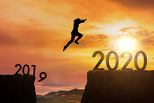 The Woman Jumping From 2019 Cliff To 2020 Cliff On Sunrise Time