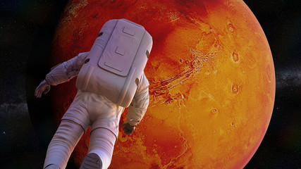 Wall Mural - astronaut flying towards planet mars