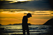 © Taweesak - Man stand alone on beach at twilight