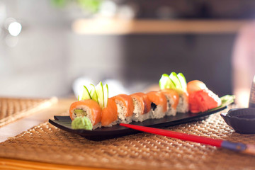 Wall Mural - Japanese food named sushi or roll with salmon and rice.