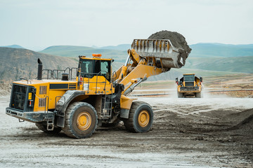 Wall Mural - mining loader wait dump truck