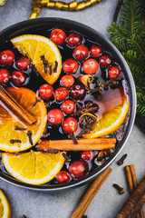 Wall Mural - Mulled Wine with Traditional Ingredients on Festive Christmas Table