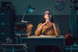 © stokkete - Confident businesswoman sitting at desk
