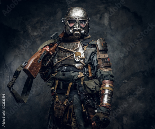 Portrait of a man in interesting costume of dark apocalypse warrior at photo ...