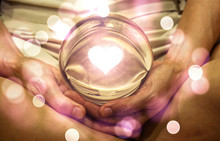 Spiritual Background: Fortune Teller Concept, Meditation Hand With Shining Heart Shape In Magic Glass Ball,sign Of Love And Peaceful