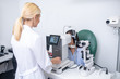 © zinkevych - Close up of ophthalmologist using modern equipment while examining patient