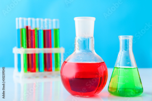 Test tubes and flasks with colorful samples in laboratory