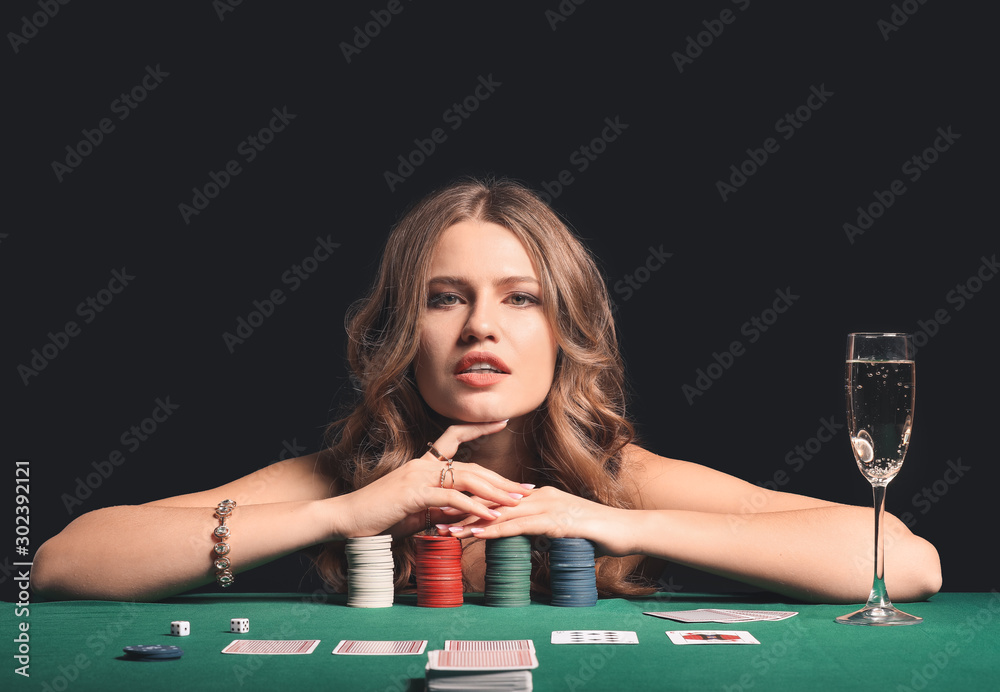 Female poker player at table in casino
