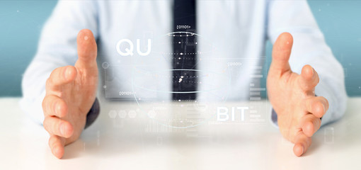 Poster - Businessman holding Quantum computing concept with qubit icon 3d rendering