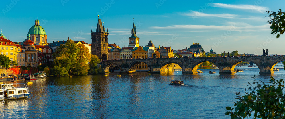 View of Charles bridge in autumn sunny day. Prague. Czech republic - obrazy, fototapety, plakaty 