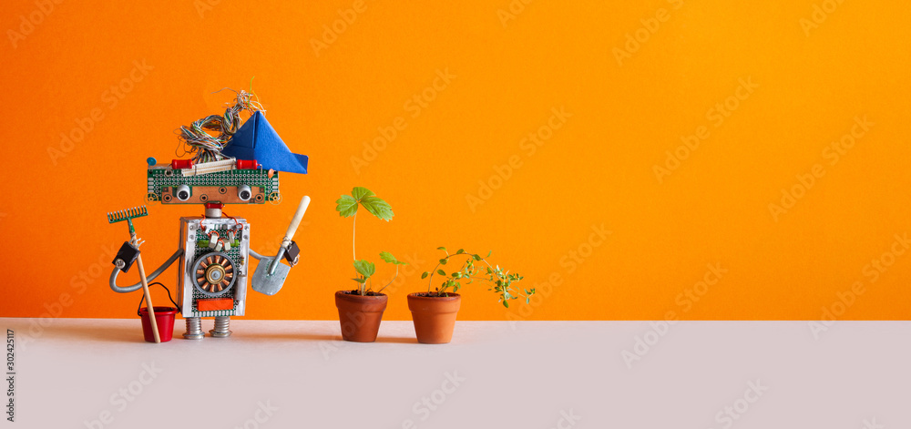 Agriculture gardening poster. Toy gardener with bucket shovel rake and sprouts of wild strawberries in clay flower pots. Orange background, copy space - obrazy, fototapety, plakaty 