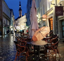  Autumn Rainy Evening In Old Town Of Tallinn, Estonia, Travel To Europe, Pink Umbrella And City Light Reflection On Pavement  People Walking On The Street City Lifestyle Travel To Europe  Street Cafe 