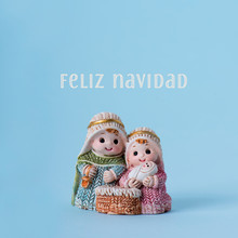 Holy Family And Text Merry Christmas In Spanish.