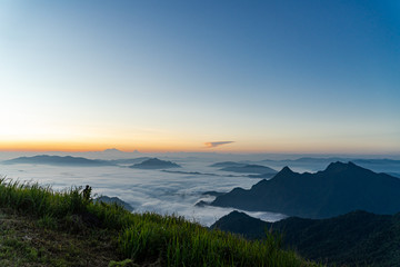 Sunrise and Mist mountain in Phu Chi Fa located in Chiang Rai, Thailand. Phu Chi Fa is the natural border between Thailand and Laos.