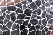 © Victor - Abstract texture of wall of black stone on a white background.