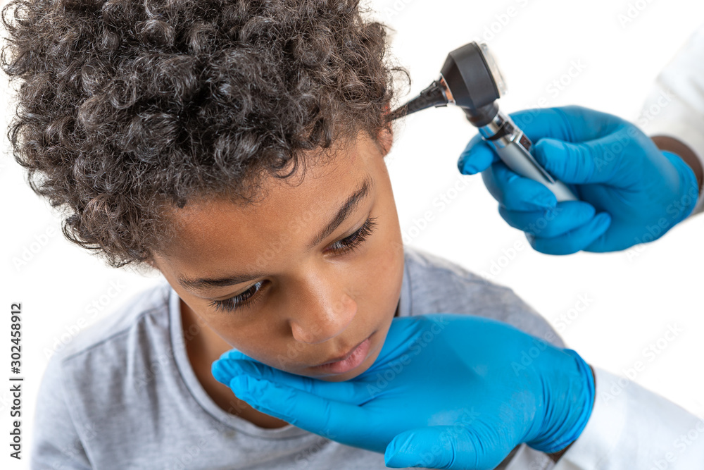 Otoscope Examination: Physician performing ear examination during a ...