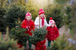 © famveldman - Kids buying Christmas tree