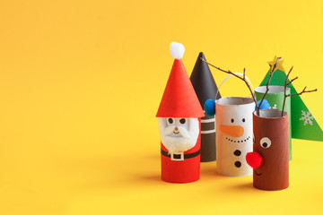 merry christmas toy collection santa claus, snowman, tree, reindeer on yellow for winter holiday con