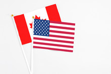 United States And Canada Stick Flags On White Background. High Quality Fabric, Miniature National Flag. Peaceful Global Concept.White Floor For Copy Space.