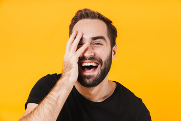 Sticker - Image of brunette man in black t-shirt laughing and touching his face