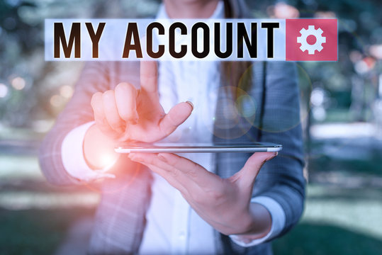 Text sign showing My Account. Business photo text If something is said to be on someone s is or something s is account Outdoor scene with business woman holds lap top with touch screen