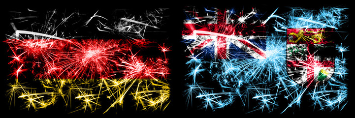 Germany, German vs Fiji New Year celebration travel sparkling fireworks flags concept background. Combination of two abstract states flags.