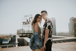 © Alina Schessler - Young urban couple posing on sunny rooftop