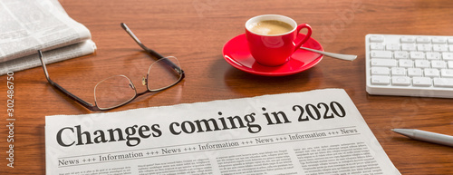 Fotografía A newspaper on a wooden desk - Changes coming in 2020
