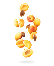 Fresh Whole And Sliced Fresh Apricots In The Air On A White Background