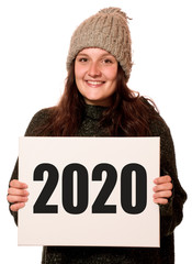 Canvas Print - Junge fröhliche Frau hält Schild mit 2020