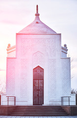 Wall Mural - Mausoleum of Ibray Altynsarin in Kostanay, Kazakhstan, in autumn 2019.Against a bright sunset.