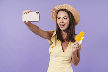 Canvas Print - Cheerful pretty girl wearing summer dress and straw hat