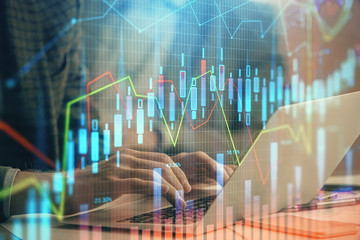 Fototapete - Double exposure of stock market chart with man working on computer on background. Concept of financial analysis.