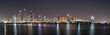 Dubai skyline panorama at night showing skyscrapers and new constructions and lights on the water