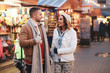© Fxquadro - Beautiful romantic couple enjoy their Christmas day on traditional festive market.