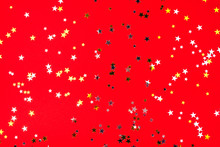 Golden And Silver Stars On Red Background. Flat Lay, Top View.
