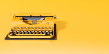 Yellow Typewriter On Yellow Background Close-up