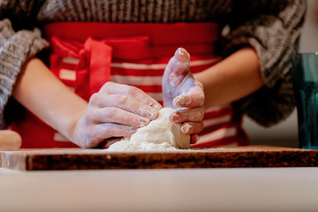 Wall Mural - woman preparing dough for dumplings