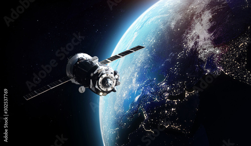 Fotomural Cargo spaceship on orbit of the Earth planet