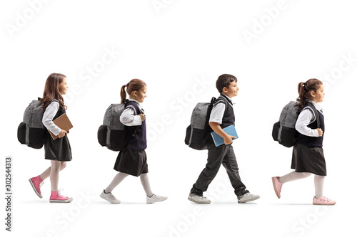 Fotografía Schoolchildren in uniforms walking in line