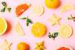 Fresh fruits on pink background, top view