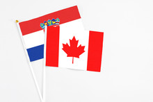 Canada And Croatia Stick Flags On White Background. High Quality Fabric, Miniature National Flag. Peaceful Global Concept.White Floor For Copy Space.