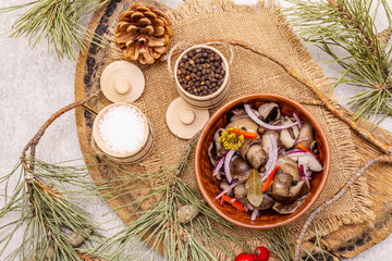 Wall Mural - Pickled (fermented) mushrooms. Traditional New Year (Christmas) snack. Festive table cutlery setting