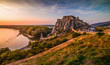 © kaycco - Famous Devin Castle Ruin Located at Confluence of Danube River and Morava River near Bratislava, Slovakia at Sunset