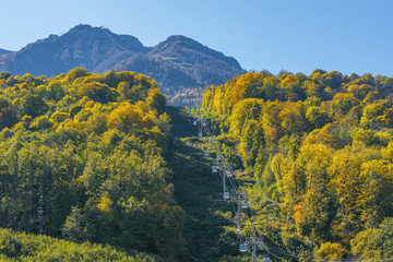 Cable way to the mountains at sunny day time. Krasnaya Polyana. Sochi.